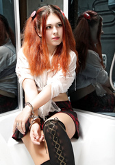 Irina in handcuffs in the bathroom