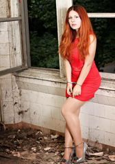 Handcuffed girl explores abandoned building