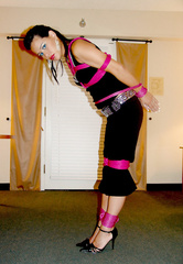 Purple rope, pants, and a ball gag