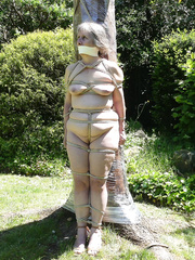 Ghis tied up naked to the "totem"