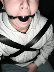 Seatbelted and ball gagged
