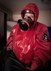 Woman in gas masks and hazmat suits