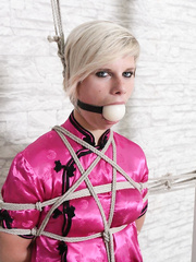 Fully clothed girl in black pantyhose tied with ropes