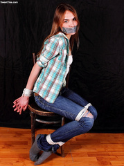 girl chairtied in socks and jeans