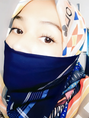 Woman in hijab with handkerchief