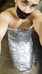Mummified to a chair